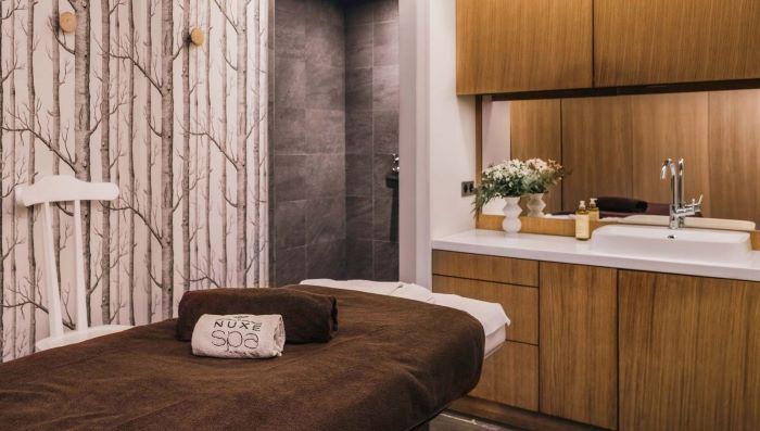 Indulge in a spa-like experience within the comfort of your bedroom by incorporating scented candles, essential oils, and plush towels.